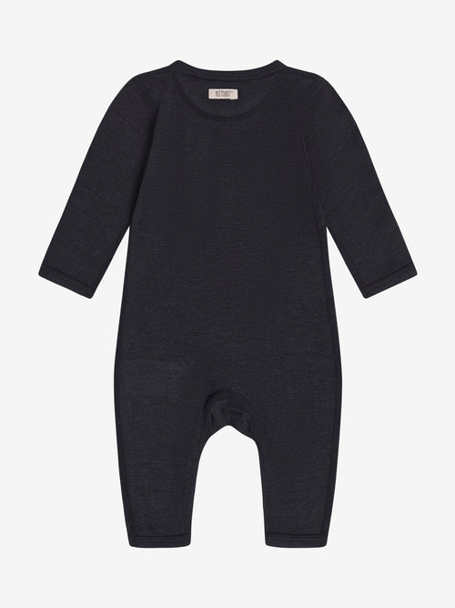 Combinaison Dark Navy – TENCEL™ & laine mérinos – Huttelihut : vue de dos de la combinaison bleu foncé.