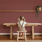 Quilt Check Bordeaux Red – Atelier Chien: wallpaper behind a child at a wooden table.